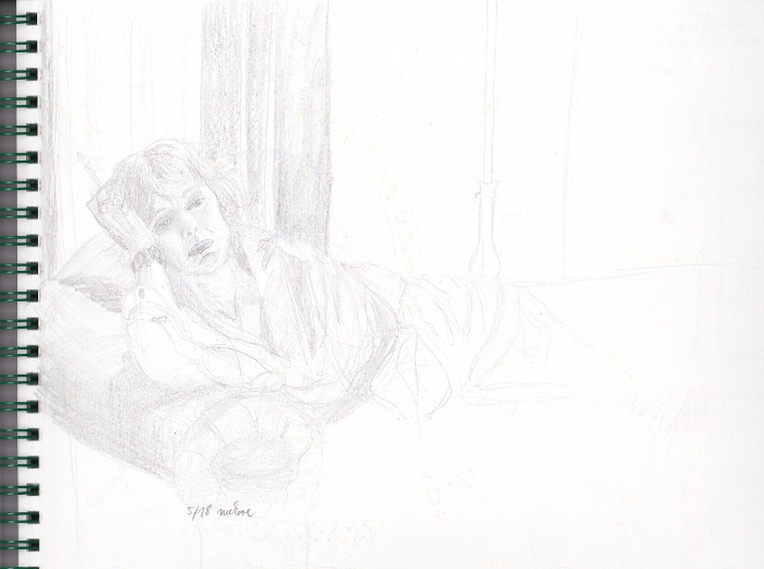 woman lying langerously on a couch with a cigarette